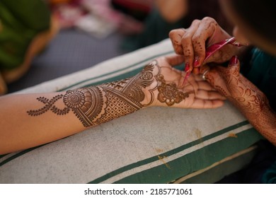 Close up shot of Indian groom hand with henna design. "selective focus" "shallow depth of field" "follow focus" or " blur".
