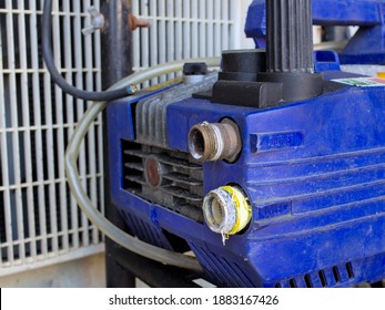 Close Up Shot Of Inlet And Outlet Of A Pressure Washer Machine.