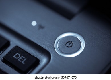 Close Up Shot Of A Laptop Power Button.