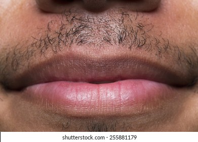 Close Up Shot Of Male Lips With A Mustache And A Gentle Smile