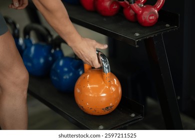 A close up shot of a man gripping dumbbells, ready to push through his intense workout in the gym, displaying focus, strength, and determination