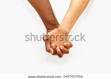 Close up shot of an mature couple holding hands. Black man and white woman in tender situation against racism. Stock photo © 