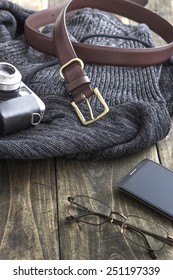 Close Up  Shot Of Men's Winter Clothes Laid Out On A Wooden Background