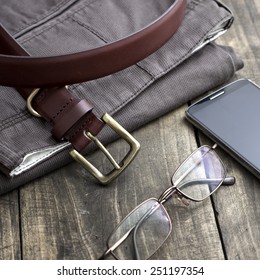 Close Up  Shot Of Men's Winter Clothes Laid Out On A Wooden Background