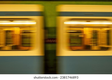 A close up shot of a modern train pulling into a subway station in Munich, Germany