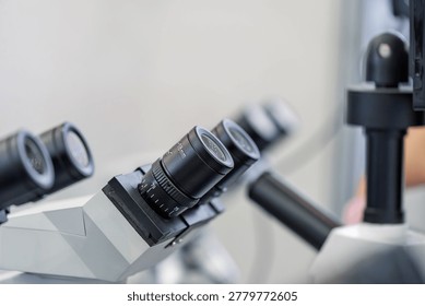 Close up shot of multi eyepiece microscope in laboratory