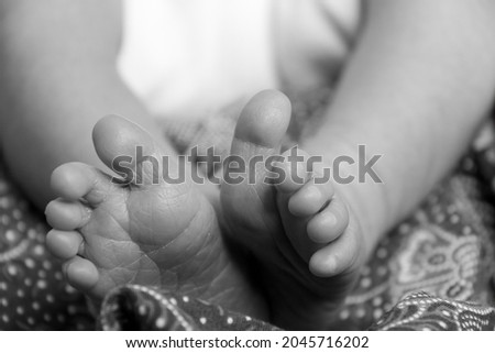 Close up shot of a newborn baby's foot.