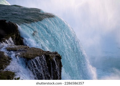 Close up shot of Niagara River - water flowing down the rocks in Niagara Falls, New York, USA