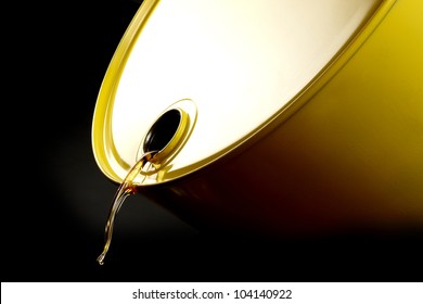 Close Up Shot Of Oil Trickling Out Of Yellow Barrel