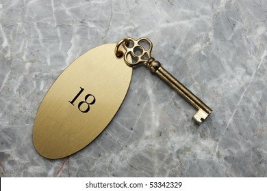 Close Up Shot Of Old Hotel Room Key Shot On Marble Front Desk