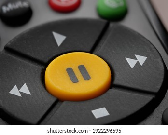 Close Up Shot Of A Pause Button On A TV Remote