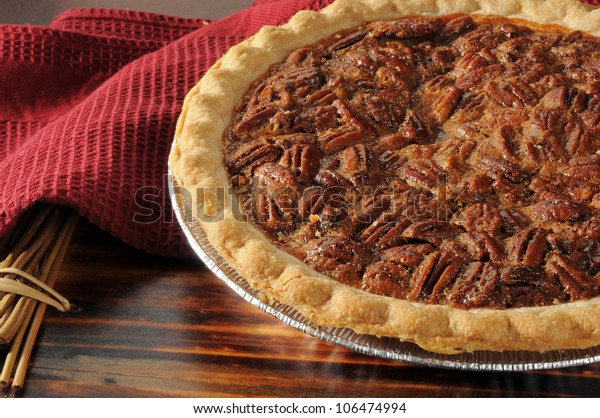 Close
up shot of a pecan pie cooling on a chopping
block