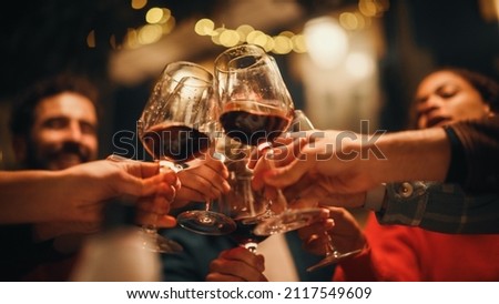 Close Up Shot of People Cheers, Making Toasts and Touch with Wine and Champagne Glasses at a Garden Party Celebration with Friends on a Warm Summer Evening. Beautiful People Enjoy Life on a Weekend.