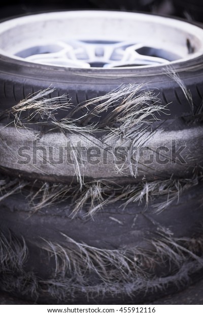 Close up shot of a\
pile of blown out tires.