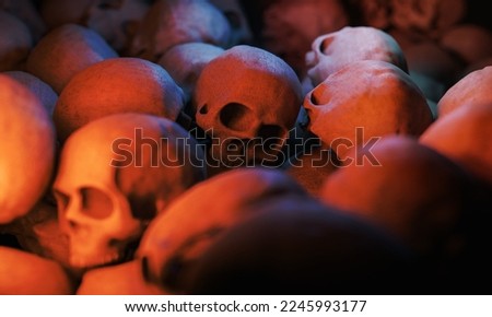 close up shot of a pile of skulls with selective focus and warm light. halloween concept. 3d rendering