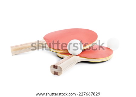 Close up shot of ping-pong bats with two balls, isolated on white background.