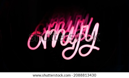 Close Up Shot of a Pink Neon Sign on a Dark Background. 