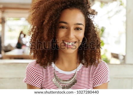 Similar – blYoung black woman, afro hairstyle, smiling outdoors