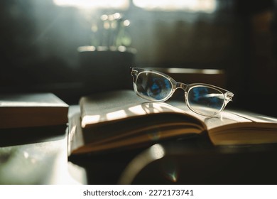 A close up shot of reading glasses on book - Powered by Shutterstock