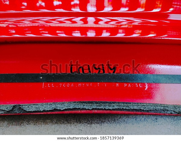 Close up shot of red car\
spoiler.