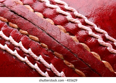 Close Up Shot Of A Red Cricket Ball