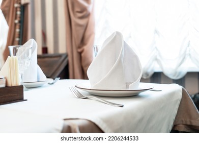 Close Up Shot Of A Restaurant Table Set Up With Tableware