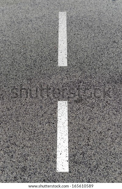 A close up shot of road\
markings