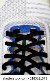 Close Shot Of Running Shoes. Laced Up White Mesh Fabric Sneakers Macro Shot.
