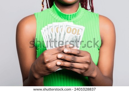 Close up shot selective focus African American woman holding banknotes bunch of money in hands dollars cash concept.