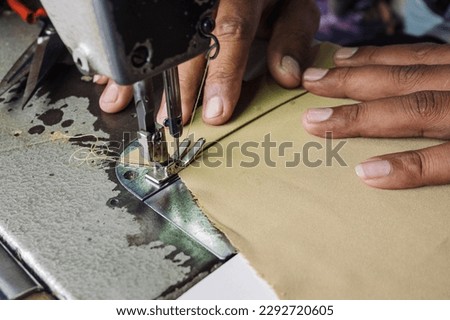 Close up shot of sewing process.