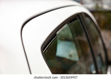 Close Up Shot Of Slightly Ajar Car Windows For Btter Cooling On Hot Summer Day