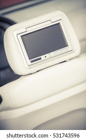 Close Up Shot Of A Small Screen Dvd Player Inside A Car.