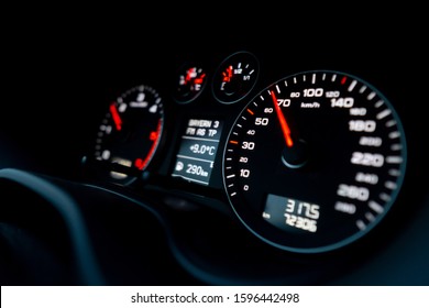 Close up shot of a speedometer in a car. Car dashboard with details with indication lamps and instrument panel. Modern interior