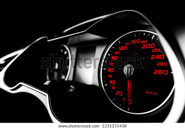 Close up shot of a speedometer in a car. Car
dashboard. Dashboard details with indication lamps.Car instrument
panel. Dashboard with speedometer, tachometer, odometer. Car
detailing. Black and
white