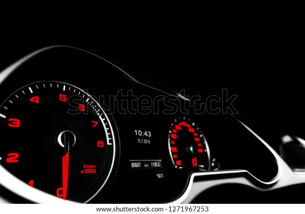 Close up shot of a speedometer in a car. Car dashboard.\
Dashboard details with indication lamps.Car instrument panel.\
Dashboard with speedometer, tachometer, odometer. Car detailing.\
Modern interior. 
