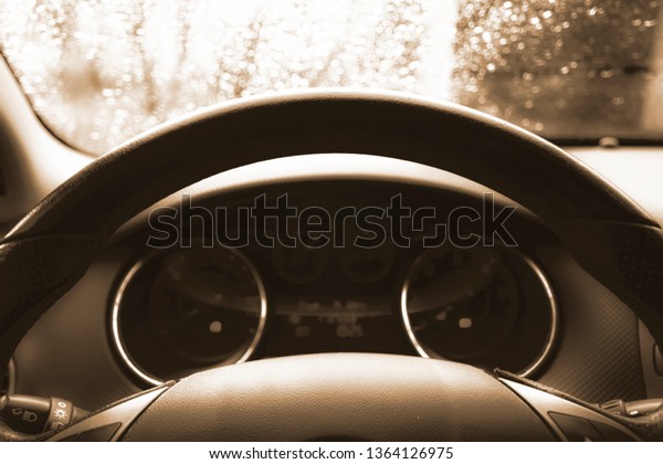 Close up shot of a speedometer in a car. Car\
dashboard. Dashboard details with indication lamps.Car instrument\
panel. Dashboard with speedometer, tachometer, odometer. Car\
detailing. Black and\
white