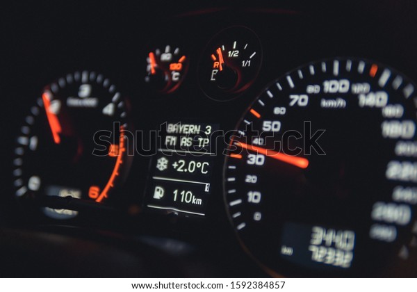 Close\
up shot of a speedometer in a car. Car dashboard. Dashboard details\
with indication lamps.Car instrument panel. Dashboard with\
speedometer, tachometer, odometer. Car\
detailing.