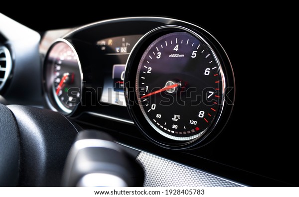 Close
up shot of a speedometer in a car. Car dashboard. Dashboard details
with indication lamps. Car instrument panel. Dashboard with
speedometer, tachometer, odometer. Car
detailing.