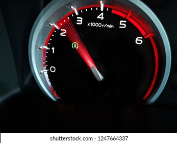 Close up shot of a speedometer in a car.   At an engine speed of 2600 rpm on  Car dashboard.Car Interior ilumination.