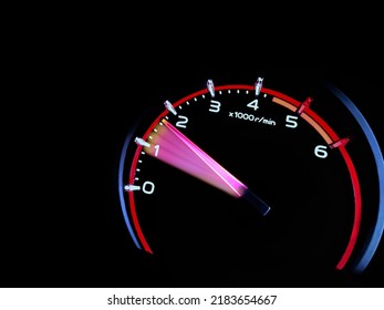Close up shot of a speedometer in a car. At an engine speed of 1800 rpm on Car dashboard.Car Interior ilumination.