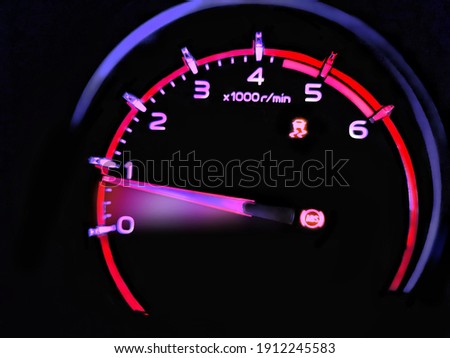 Close up shot of a speedometer in a car. At an engine speed of 800 rpm on Car dashboard.Car Interior ilumination.