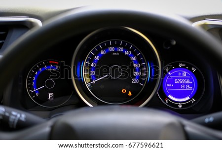 Close up shot of a speedometer in a compact car