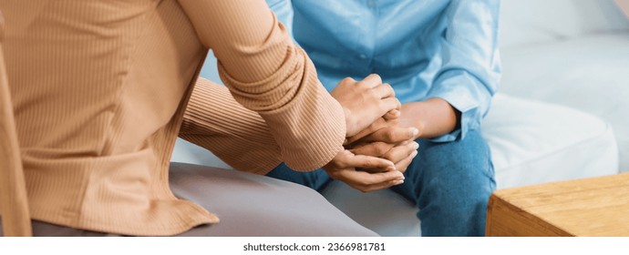Close up shot of supportive and comforting hands for cheering up depressed patient person or stressed mind with crucial empathy - Shutterstock ID 2366981781