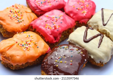 Close Up Shot Of Sweet Banana Nugget With Playful Chocolate Toppings For Birthday Parties.