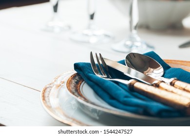 Close Up Shot Of Table Setting For Fine Dining With Cutlery And Glassware