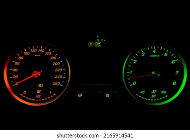 Close up shot of a tachometer in a car. Car dashboard. Dashboard details with indication lamps. Car instrument panel. Dashboard with speedometer, tachometer, odometer. Car detailing.