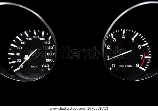 Close\
up shot of a tachometer in a car. Car dashboard. Dashboard details\
with indication lamps. Car instrument panel. Dashboard with\
speedometer, tachometer, odometer. Car\
detailing.