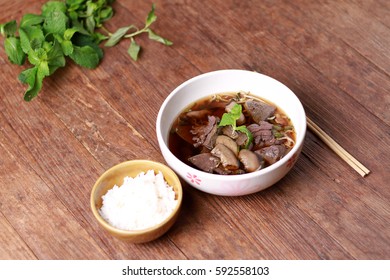  Close up shot of Thailand traditional ekaehla beef soup.( KaoLau) with Rice, food thai style.