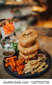 A Close Up Shot Of Traditional British Food, Sunday Roast. Yorkshire Pudding With Roasted Meat And Vegetables. Concept Of Family Lunch, Celebration And Traditional Cuisine.