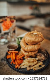 A Close Up Shot Of Traditional British Food, Sunday Roast. Yorkshire Pudding With Roasted Meat And Vegetables. Concept Of Family Lunch, Celebration And Traditional Cuisine.